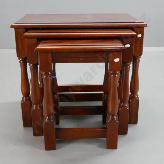 set of 3 mahogany nesting tables with turned legs, block feet and stretcher bases - minor ding to edge of large table