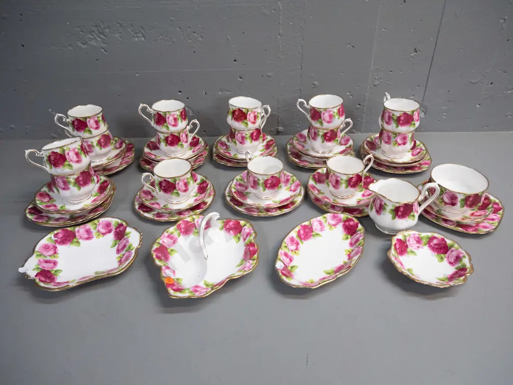 large quantity of Royal Albert Old English Rose teaware - 15 trios, cream, sugar, 4 small dishes, spare saucer & plate Image 1++