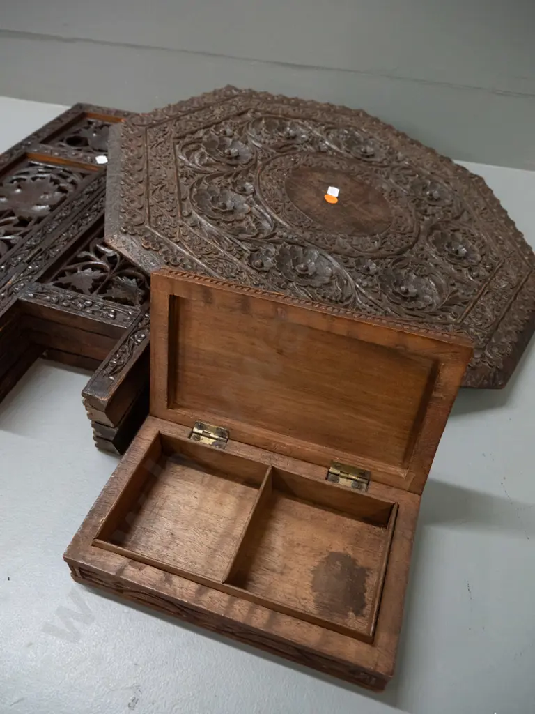 intricately carved and pierced Asian hardwood collapsible table with octagonal top, hinged stand, with similar carved Image 1++