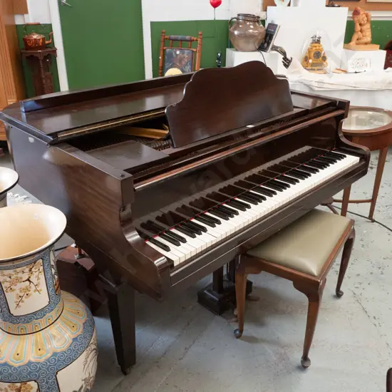B. Squire 4 ft. baby grand piano on casters, in good condition, some wear to varnish on top, needs tuning