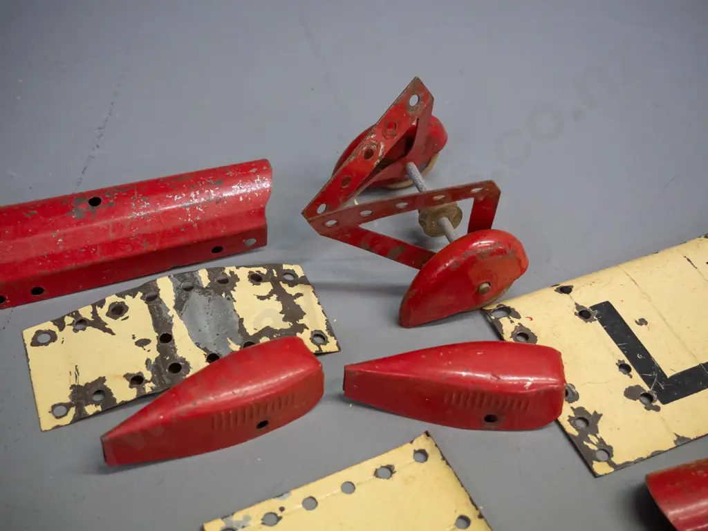 vintage metal Meccano aeroplane construction kit pieces - assorted wings, wheels, and body parts, booklet missing covers Image 1++