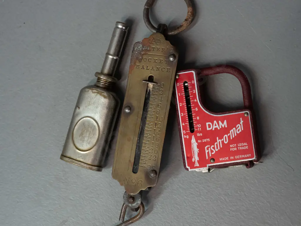vintage fly fishing items - metal fly tins, one with contents, DAM Fish-o-mat combination scale / measuring tape, small Image 1++