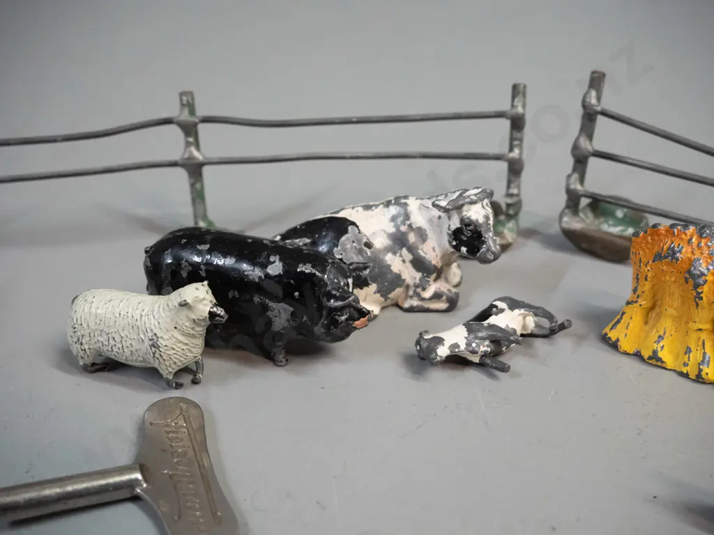 vintage lead toy farm animals, farmer, fence etc. and a small reproduction wind-up tin toy locomotive and a clock key - Image 1++