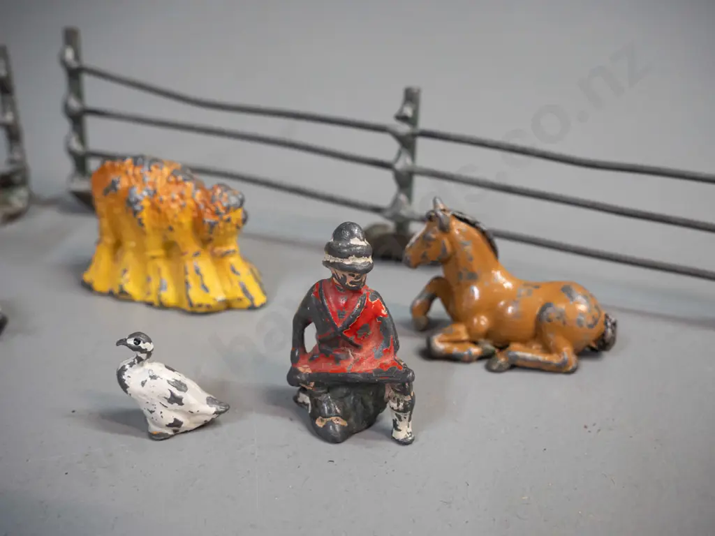 vintage lead toy farm animals, farmer, fence etc. and a small reproduction wind-up tin toy locomotive and a clock key - Image 1++