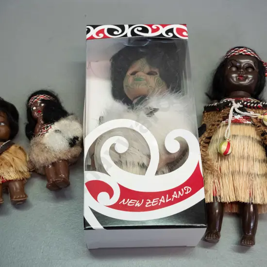 4 small plastic souvenir dolls in traditional Maori dress including Parr's doll in original box H-180 W-90