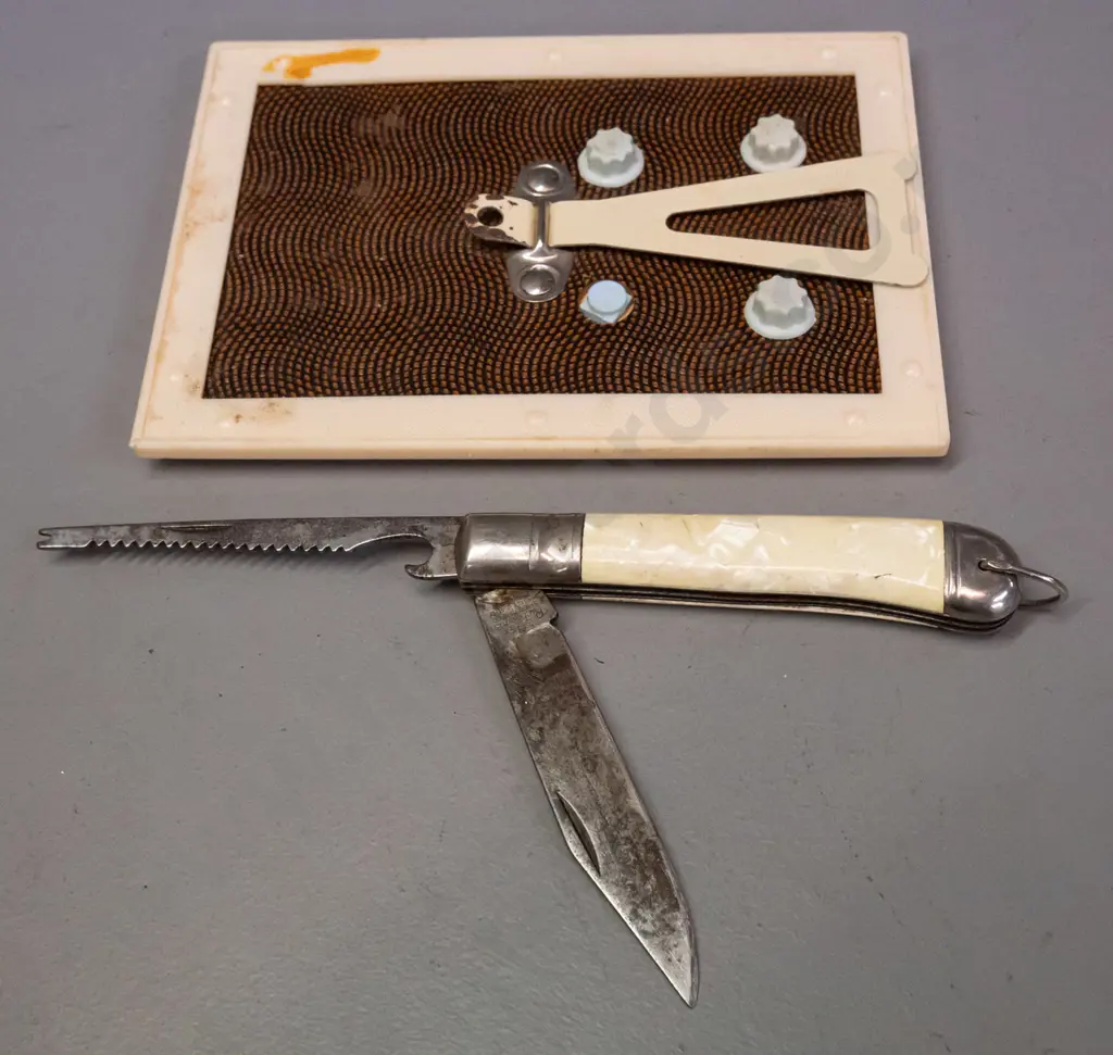 JG Leckie Ltd Milton framed perpetual calendar, spark plug bottle opener, pocket knife with saw blade, marked Richards Image 1++