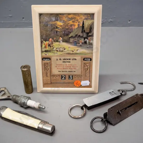 JG Leckie Ltd Milton framed perpetual calendar, spark plug bottle opener, pocket knife with saw blade, marked Richards