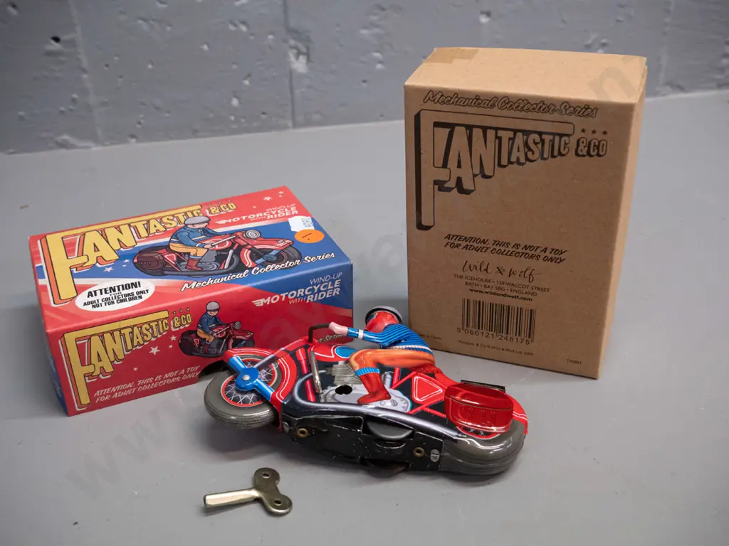 reproduction wind-up tin toy motorbike & rider, with box and key. Motorbike is L-130 Image 1++