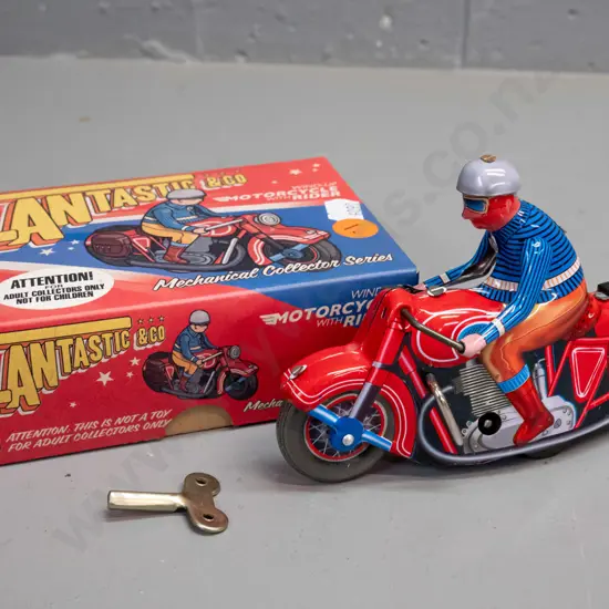 reproduction wind-up tin toy motorbike & rider, with box and key. Motorbike is L-130