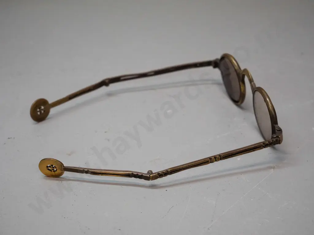 unusual folding brass framed eyeglasses  - slight chipping to lenses. W-120 folded. Image 1++