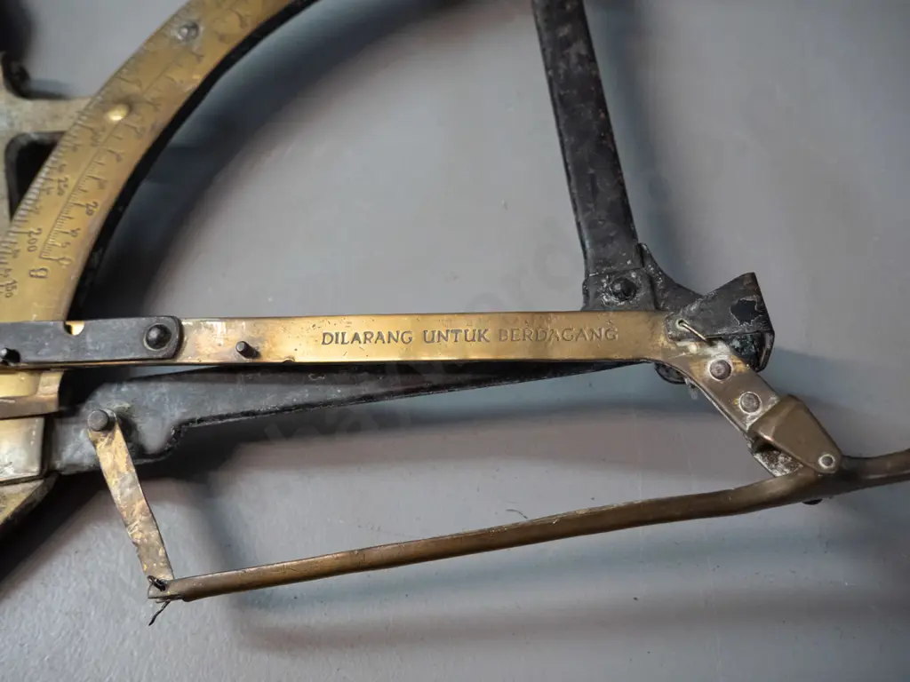 vintage brass folding swing-arm balance scales marked "dilarang untuk berdagang" which is Malay according to Google. Image 1++