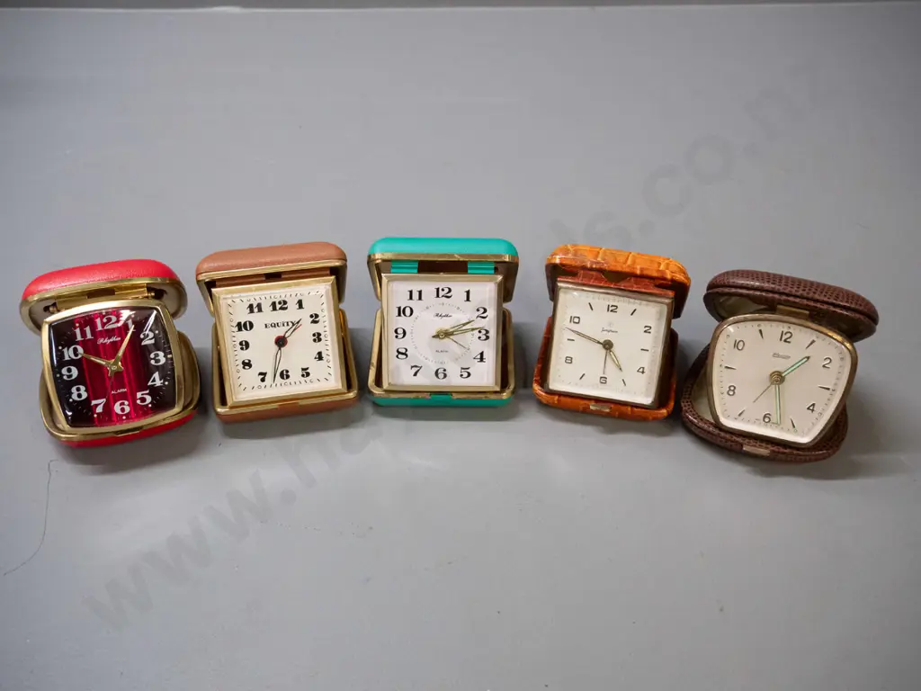 collection of 5 vintage clamshell travel alarm clocks - Equity, Blessing, Junghans and 2 Rhythm Image 1++