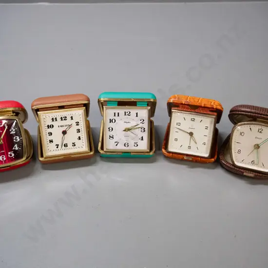 collection of 5 vintage clamshell travel alarm clocks - Equity, Blessing, Junghans and 2 Rhythm