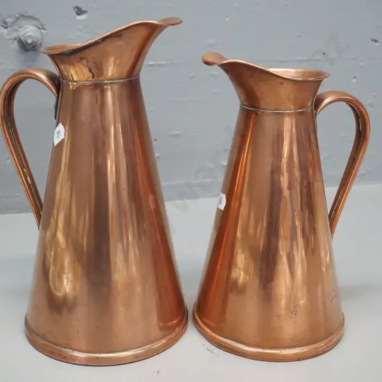 2 copper ewer jugs marked England - smaller half pint, larger marked "H" is H-230