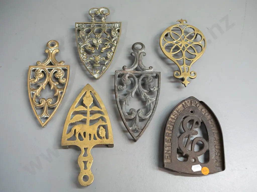 6 vintage trivets with pierced decoration - one cast iron marked "Enterprise Mfg. Co. Phila. USA" 4 brass, etc. Image 1++