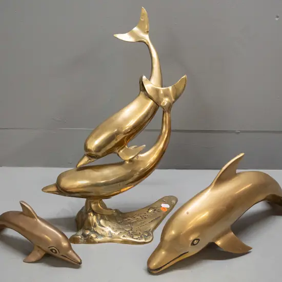 3 brass dolphin figures - taller has 2 leaping dolphins on base H-400 W-250. Minor scratches & discolouration.