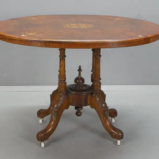 Victorian walnut loo table w/ boxwood stringing inlay & central mixed timber inlaid motif, on 4 point cathedral base,
