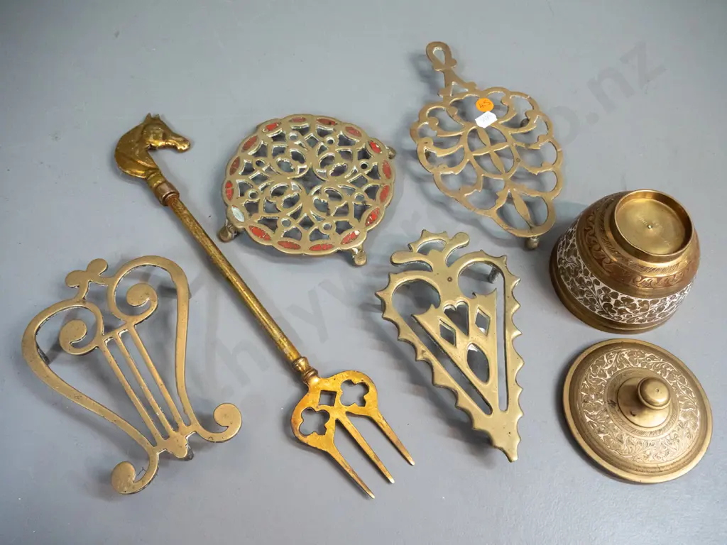 brassware - 4 vintage trivets with pierced decoration, lidded canister and a fork with horse head handle L-340. One Image 1++