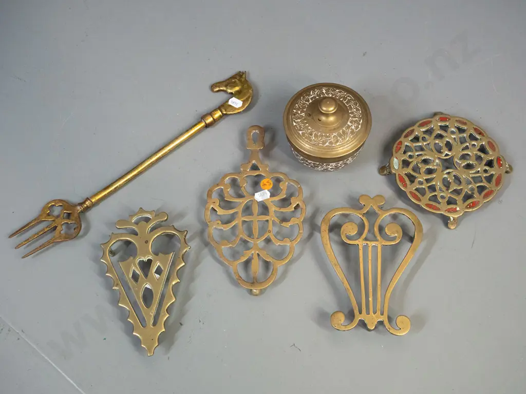 brassware - 4 vintage trivets with pierced decoration, lidded canister and a fork with horse head handle L-340. One Image 1++