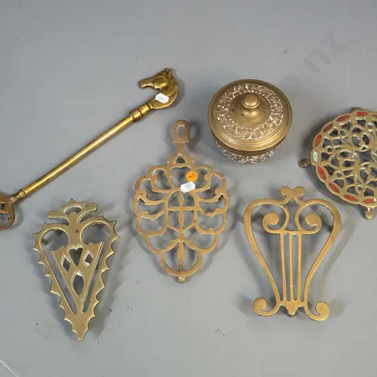 brassware - 4 vintage trivets with pierced decoration, lidded canister and a fork with horse head handle L-340. One