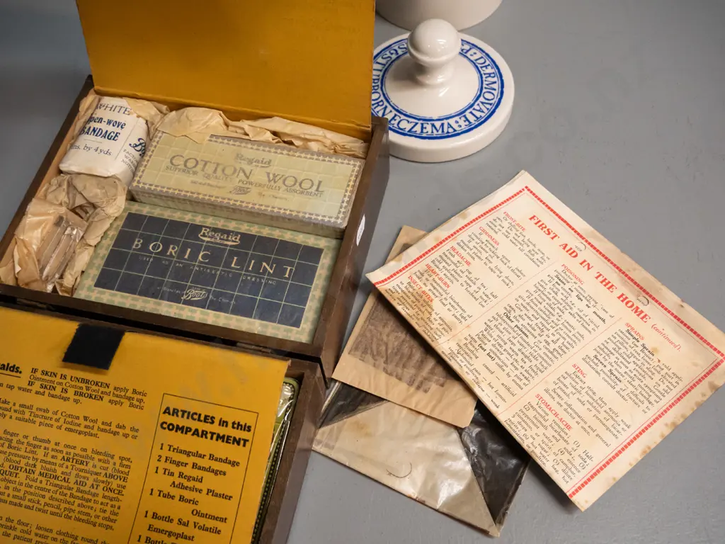 vintage Boots Drug Co. home first aid kit including original contents and a Wade porcelain Glaxo Dermavate lidded pot Image 1++
