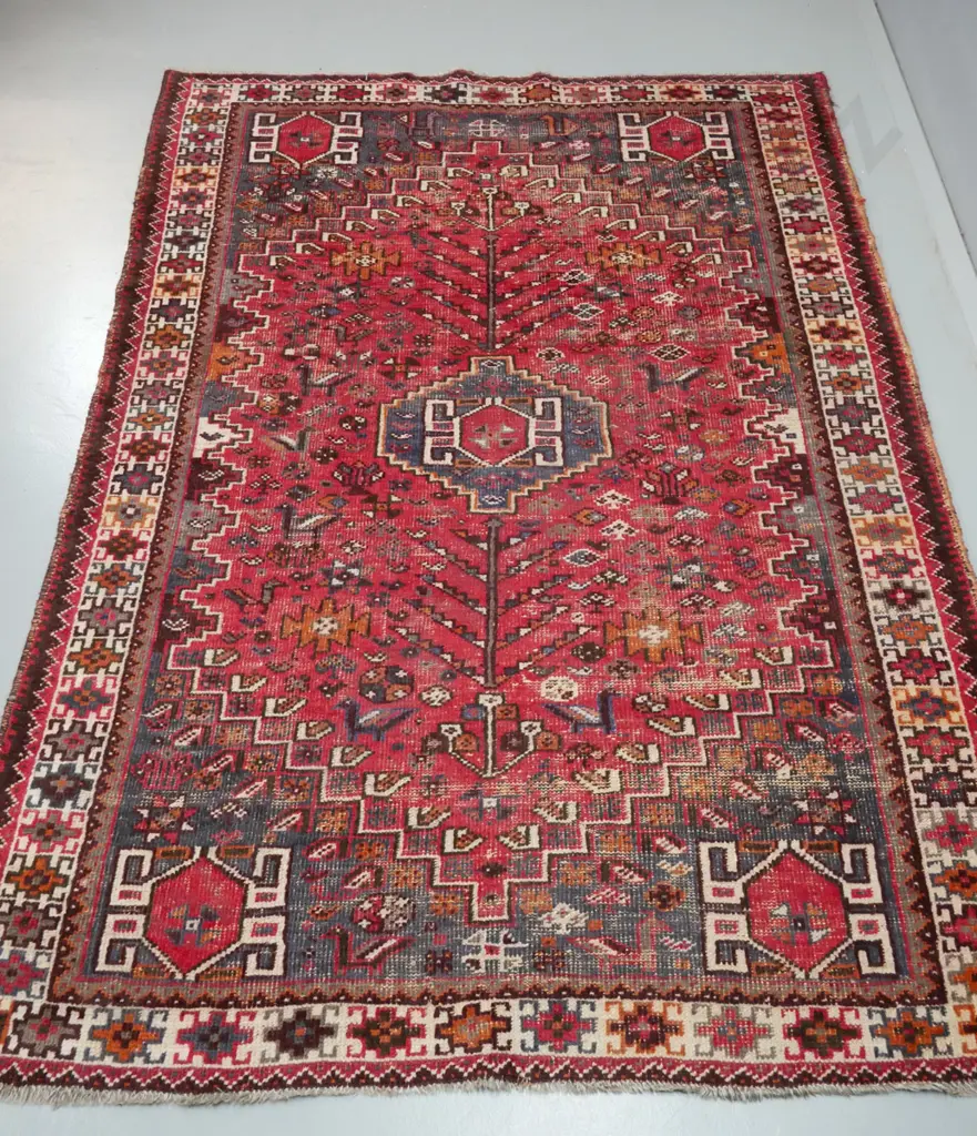 Persian style hand-knotted woollen floor rug - reds, blues, browns and beige - some fading, heavy wear L-2400 W-1710 Image 1++