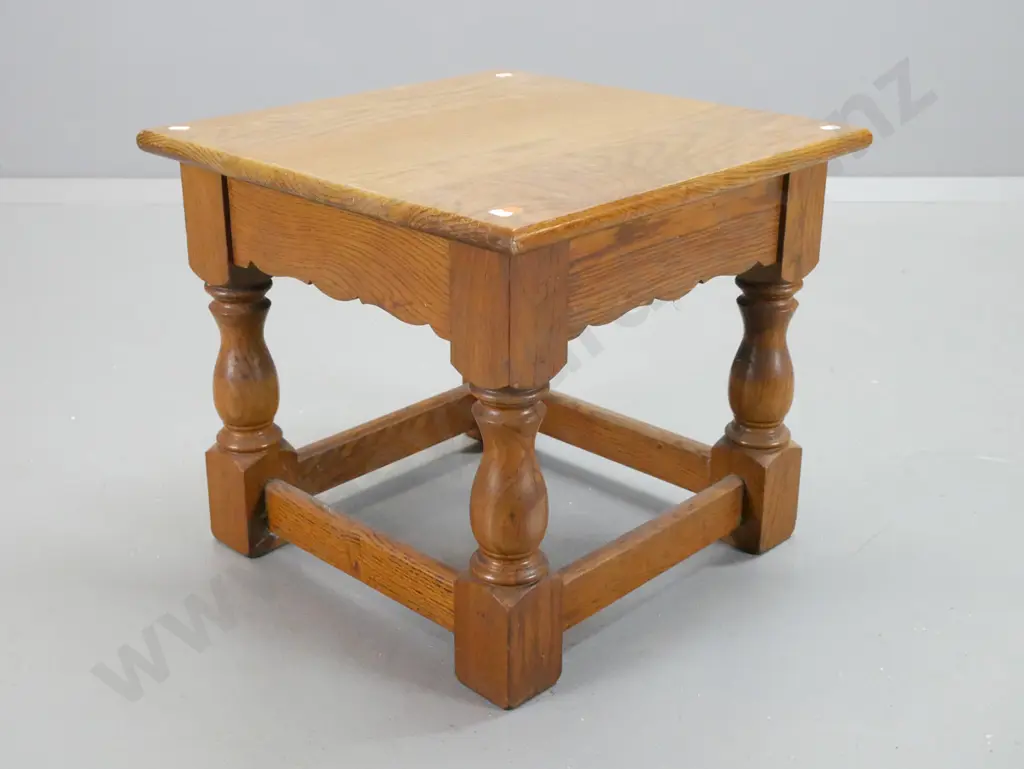 oak stretcher-based end table with turned legs, block feet and shaped aprons - some paint flecks, wear to top surface. Image 1++