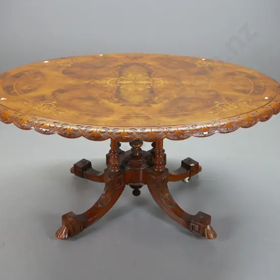 Victorian walnut loo table w/ cross-banded & inlaid boxwood & mixed timber top, shaped and carved edge, on 4-point