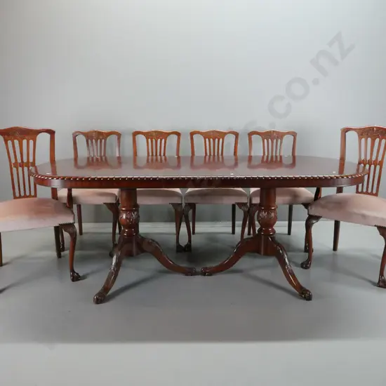 mahogany double pedestal draw-leaf dining table with gadrooned edge, one leaf, 3 point carved bases with paw feet, 6