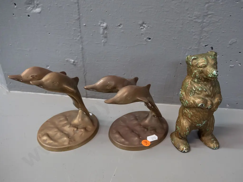 cast brass 2-piece standing bear money box and two cast brass double leaping dolphin figurines. Bear has chipped gilt Image 1++