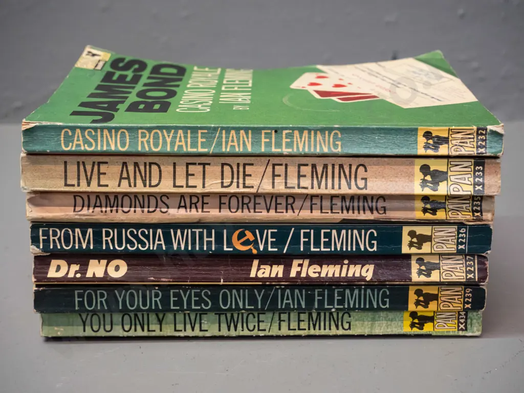 7 retro 1960s James Bond paperbacks - see photos for details, overall wear, some pen and stamps and marks Image 1++