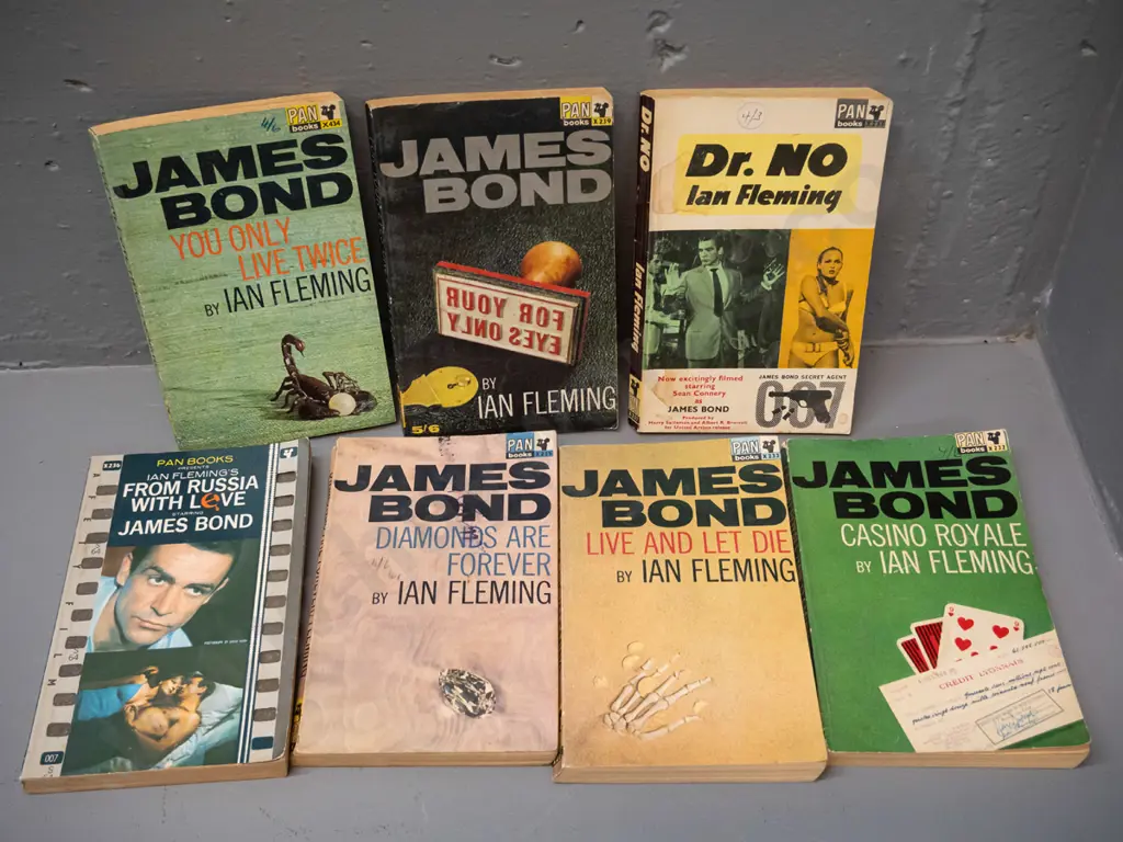 7 retro 1960s James Bond paperbacks - see photos for details, overall wear, some pen and stamps and marks Image 1++