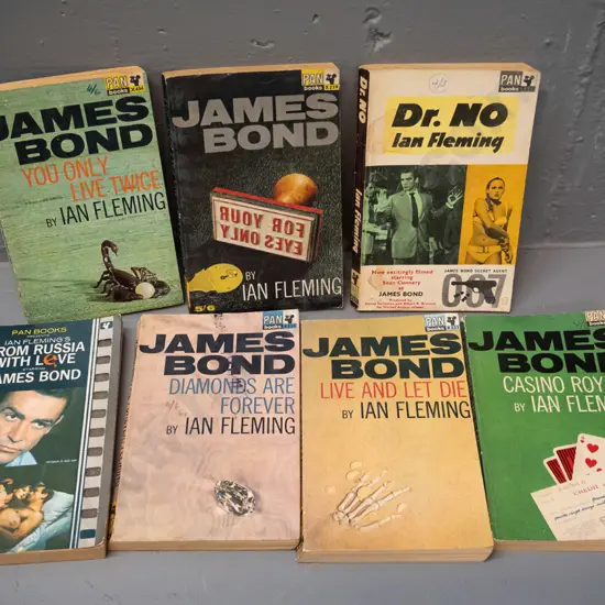 7 retro 1960s James Bond paperbacks - see photos for details, overall wear, some pen and stamps and marks