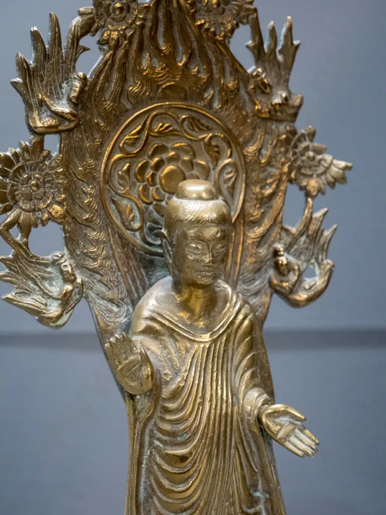 asian brass standing figure on lotus flower with pierced back piece - may have some loss to decoration on right side of Image 1++