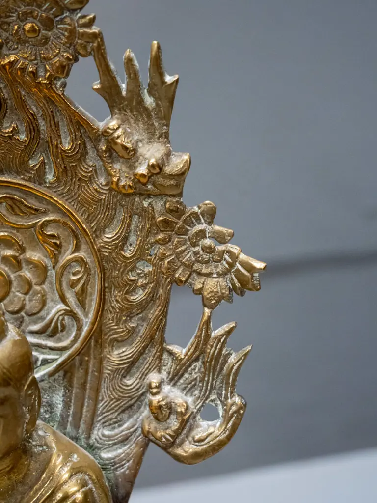 asian brass standing figure on lotus flower with pierced back piece - may have some loss to decoration on right side of Image 1++
