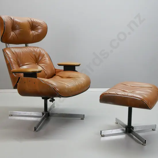 vintage Eames style leather upholstered swivel lounge chair with matching footstool, vinyl upholstered arms. Missing