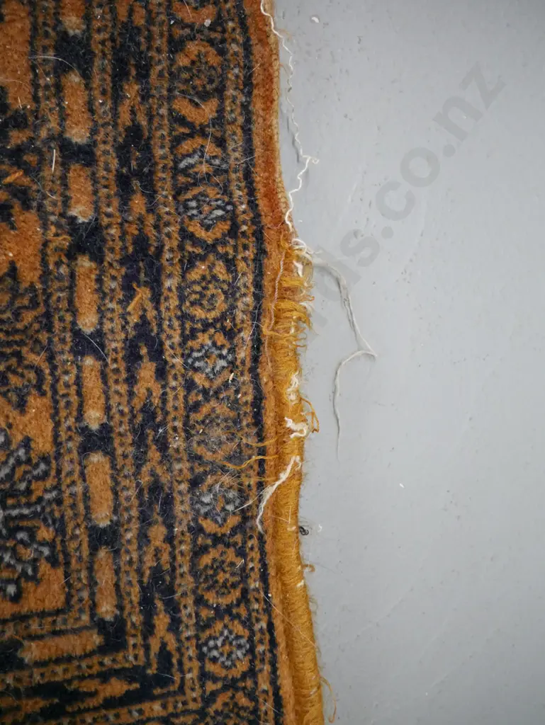 Persian style wool floor rug with "Keshan" label - mustard, dark blue and ivory with knotted fringe - staining, fraying Image 1++