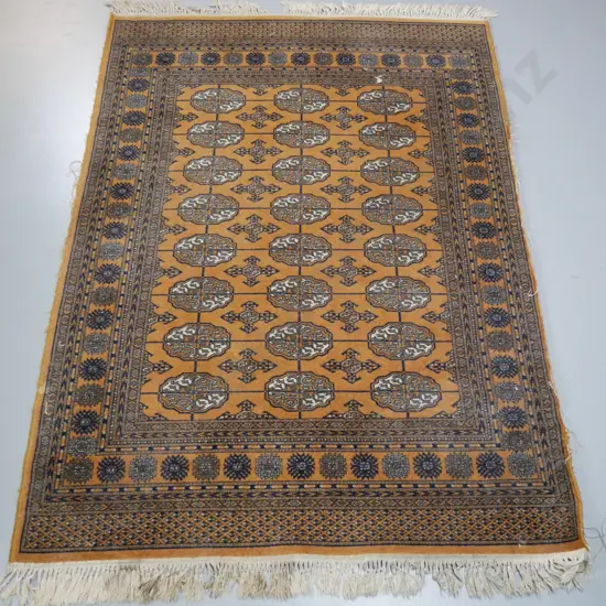 Persian style wool floor rug with "Keshan" label - mustard, dark blue and ivory with knotted fringe - staining, fraying