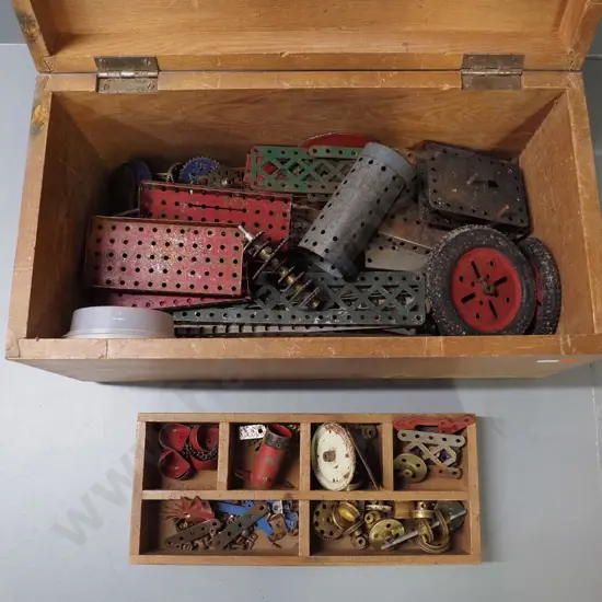 wooden chest and small segmented tray of vintage Meccano pieces in very play-worn condition. Chest H-230 W-460 D-235