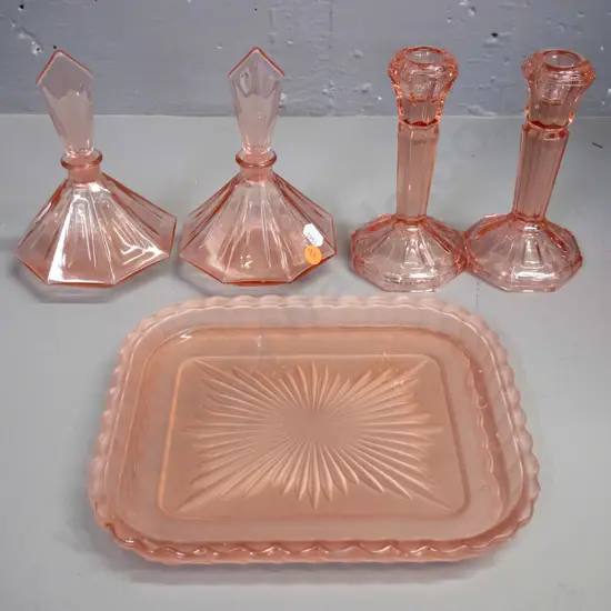 deco moulded pink glass dressing table ware - 2 stoppered scent bottles, 2 candlesticks and a tray. Bottles H-140
