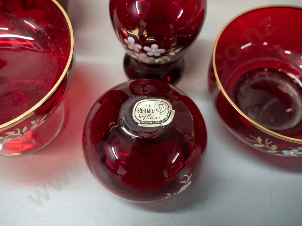 9 small pieces of Bohemian ruby glass with enamel floral motifs and gilt rims - label to base of one, tallest is H-85 Image 1++
