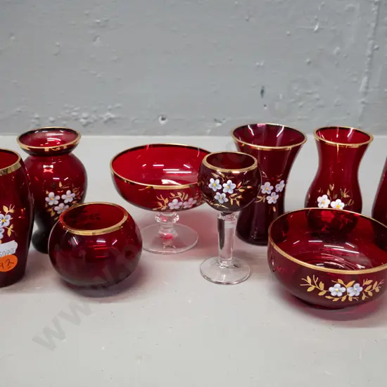 9 small pieces of Bohemian ruby glass with enamel floral motifs and gilt rims - label to base of one, tallest is H-85