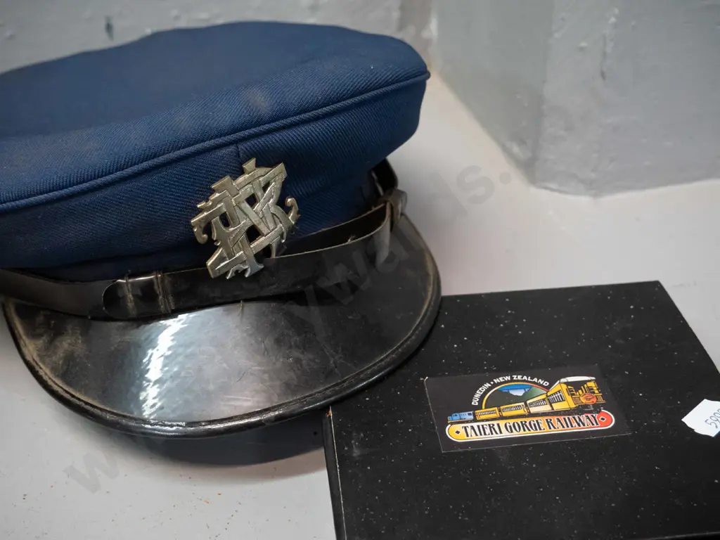 2 caps, one with NZR badge, made by Treister, plain black has Hills Hats, and a souvenir Taieri Gorge cross-section of Image 1++