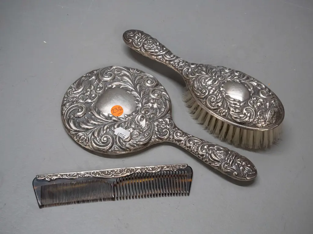 3 piece sterling silver mounted dressing table set - bevelled round mirror, brush and comb - with bird and "green man" Image 1++