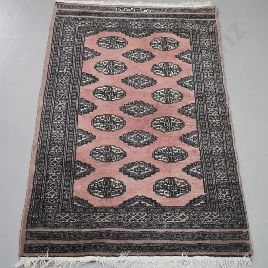 small hand knotted wool floor mat or prayer rug with small panel of Arabic script, some wear and fading L-1220 W-760