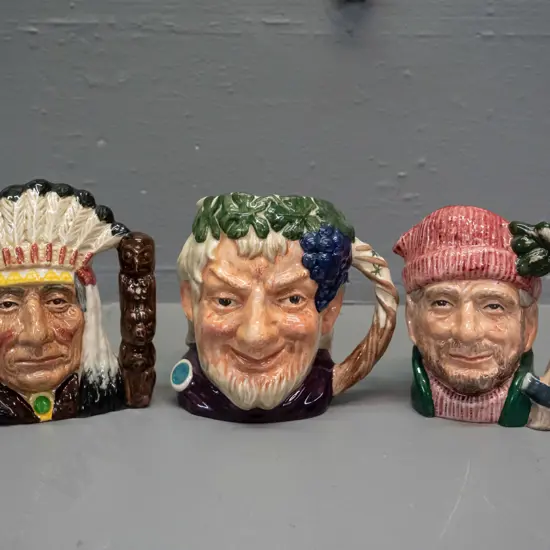3 small to medium size Royal Doulton character jugs - North American Indian H-110, Bacchus, and Lumberjack