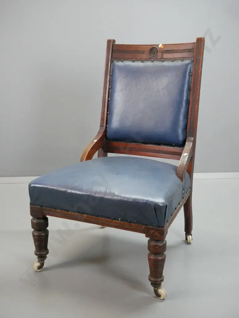 Edwardian walnut lady's chair with fluted uprights, turned legs on porcelain casters, covered in blue vinyl - wear Image 1++