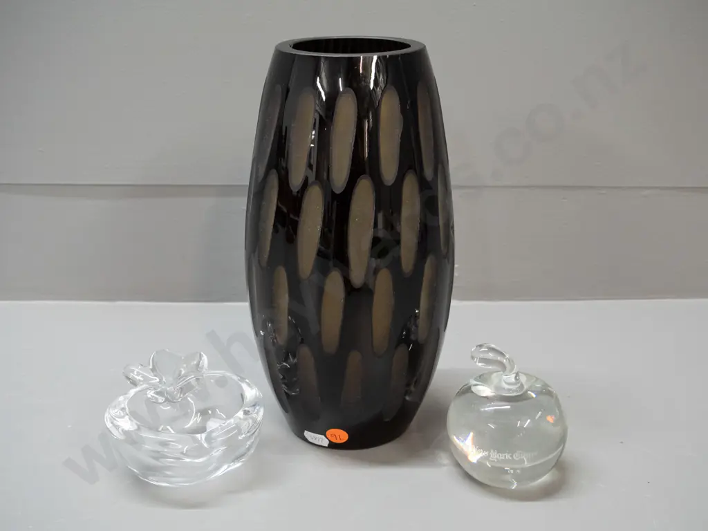 3 pieces of glass - black over amber art glass vase with cut ovals, French clear glass apple shaped dish and an apple Image 1++