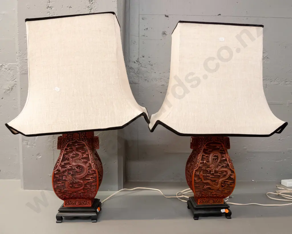 pair of composite Chinese cinnabar style dragon pattern table lamps on painted wood bases with rectangle shaped linen Image 1++
