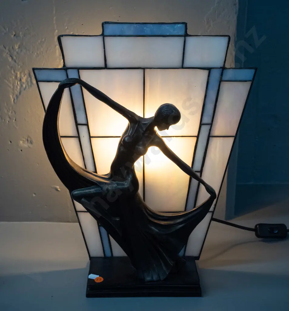 deco style table lamp with dancing woman, leadlight back panel sits in slot, base is composite with faux bronze finish Image 1++